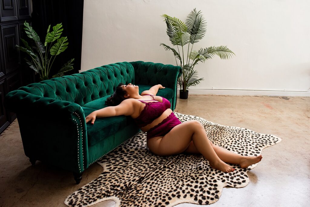 plus size woman posing on couch